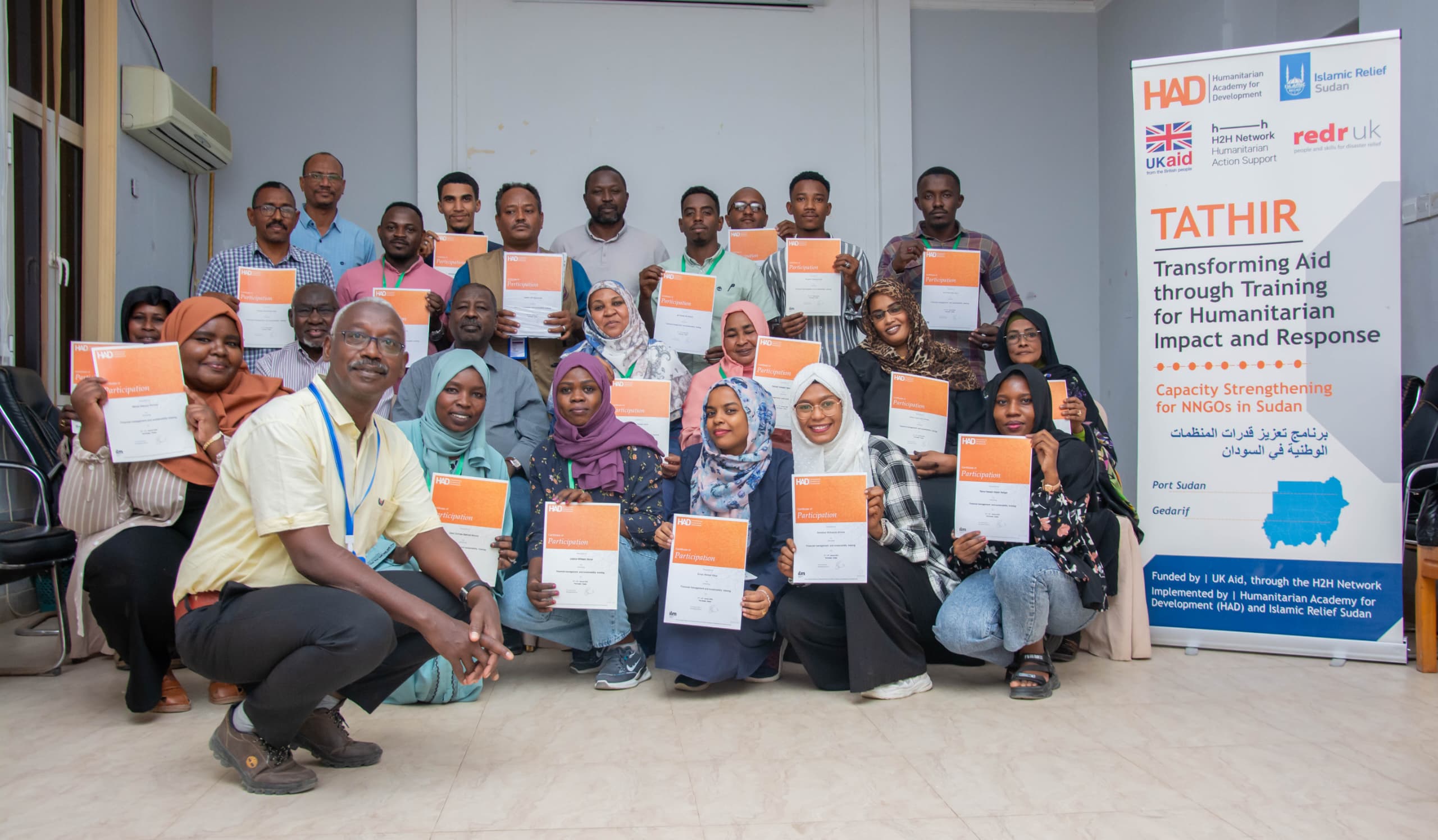 Participants holding HAD certificates of participation at a capacity strengthening training in Sudan